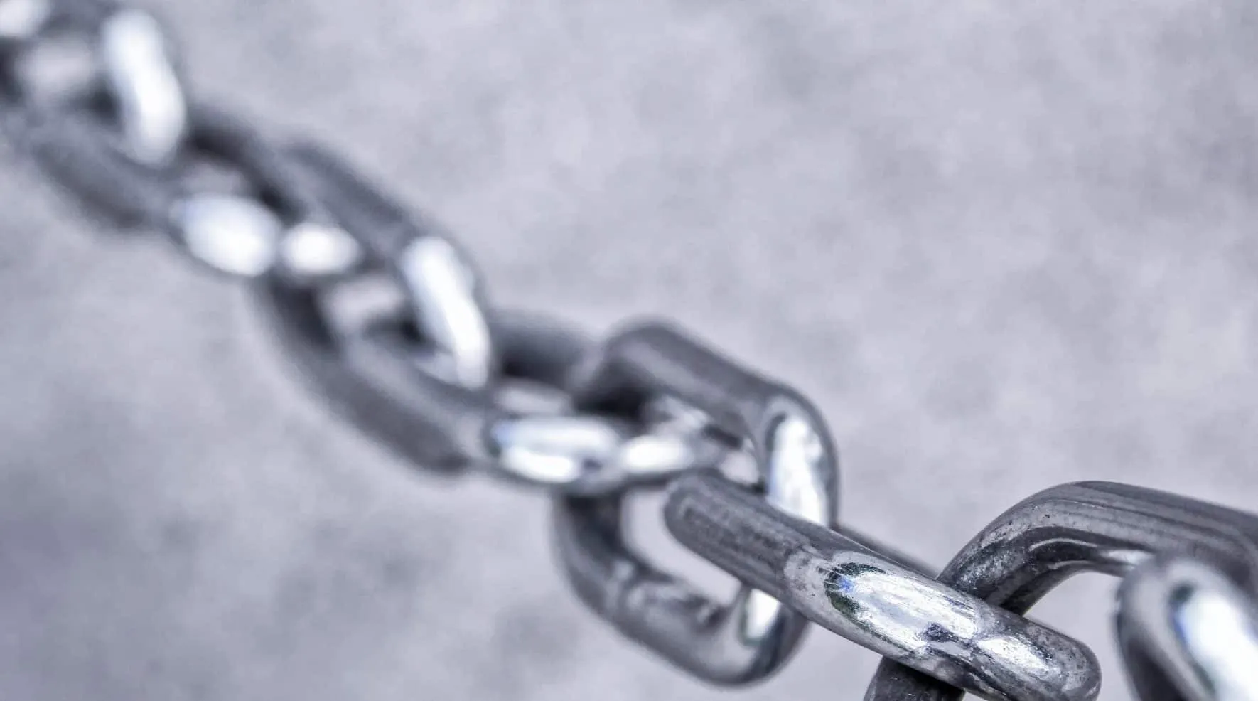 Taut metal chain in close-up