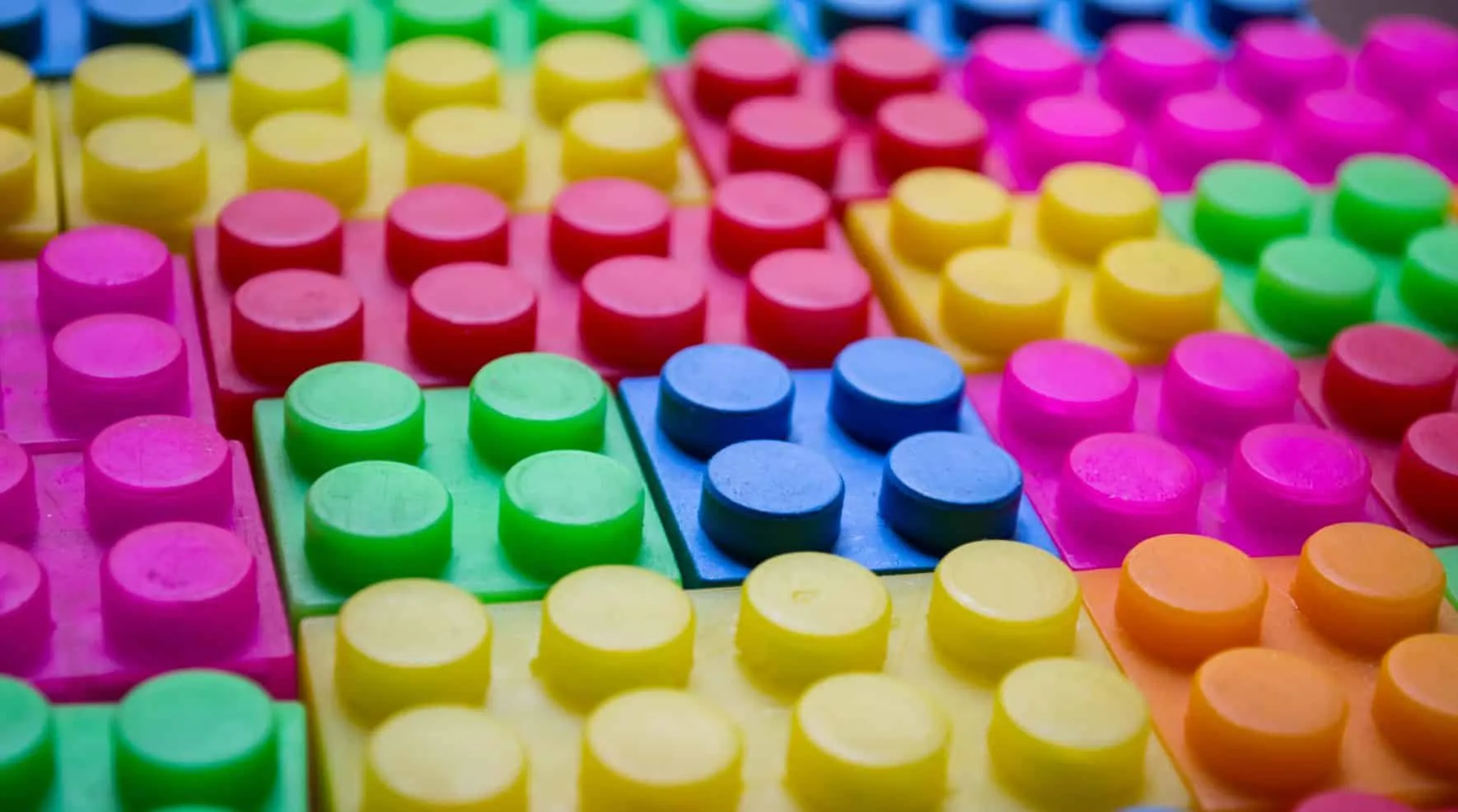 Colorful building bricks packed tightly side by side