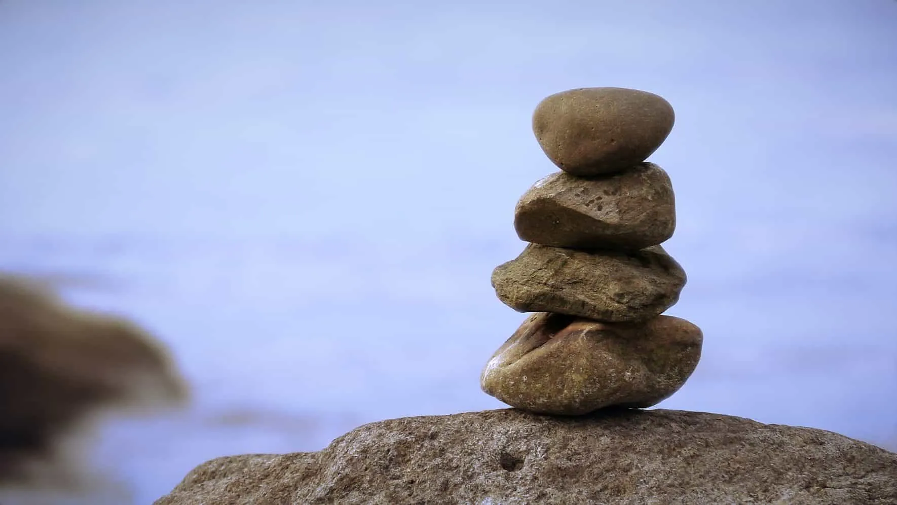 Tower of stacked stones on a rock