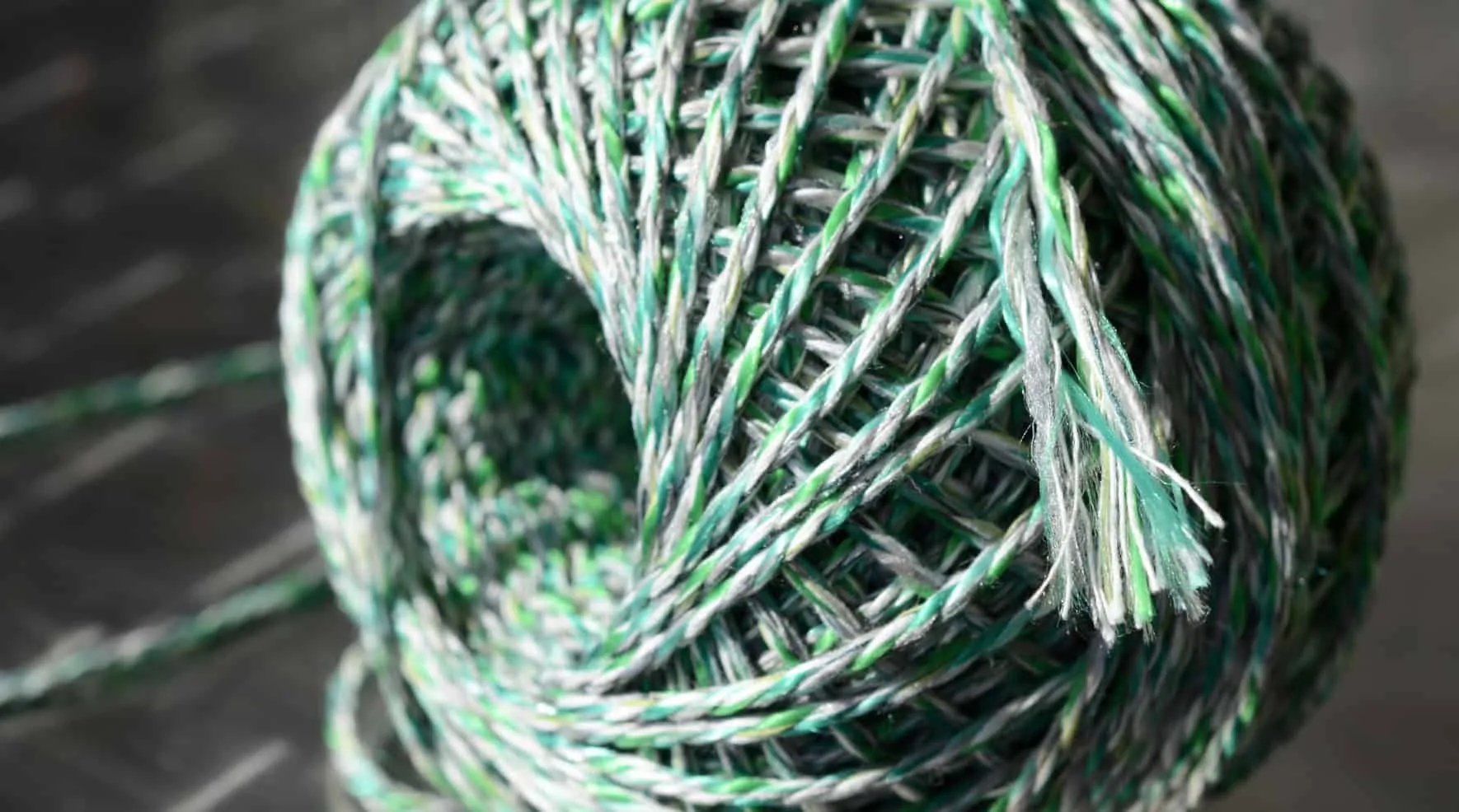 Coiled green and white cord seen from above