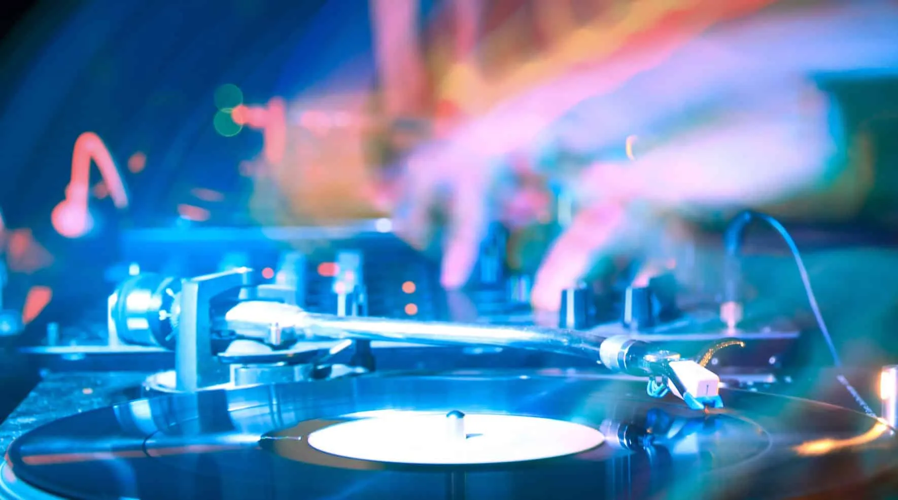 Record player with tonearm in colorful light
